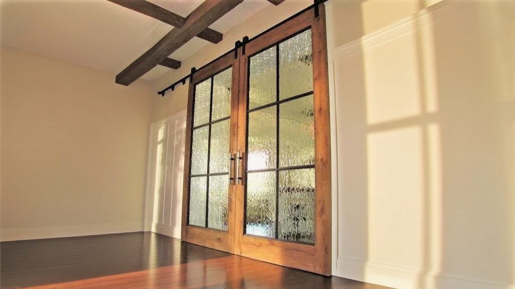 Textured glass for sliding track doors for entrances